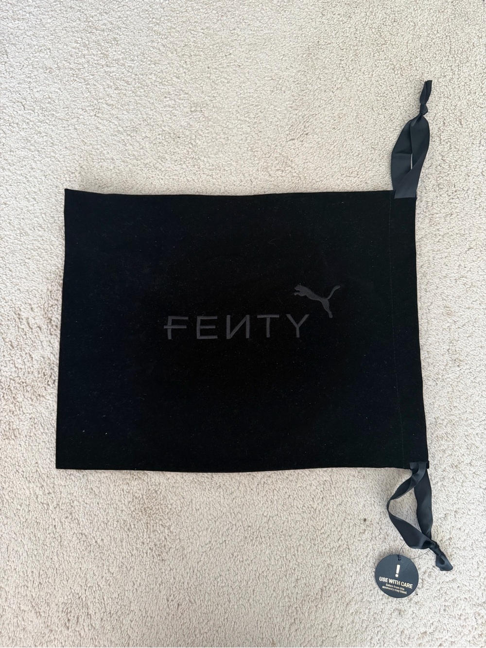 Fenty x Puma by Rihanna black velvet dust bag with tonal logo and satin ribbon d
